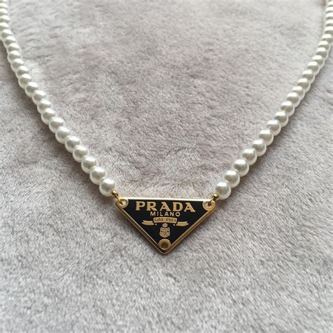 pearl necklace prada|prada symbol necklace.